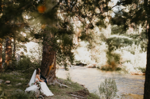 Bride overlooking the private river at this off the beaten path wedding venue in Lake Tahoe