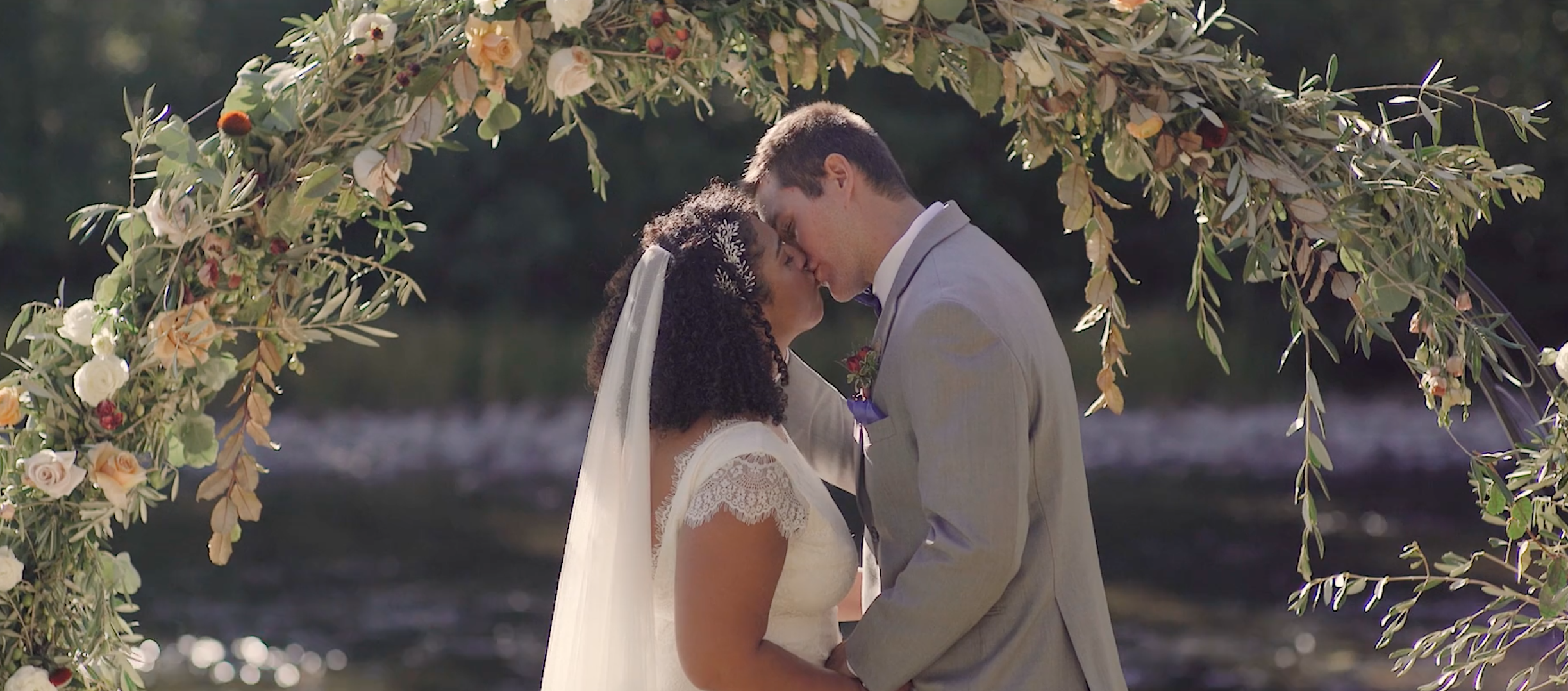 Mixed Race couple kissing at a private estate wedding in Lake Tahoe