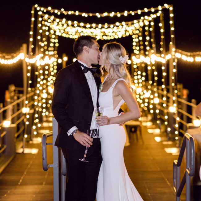 Magical lighting with twinkle lights behind the bride and groom